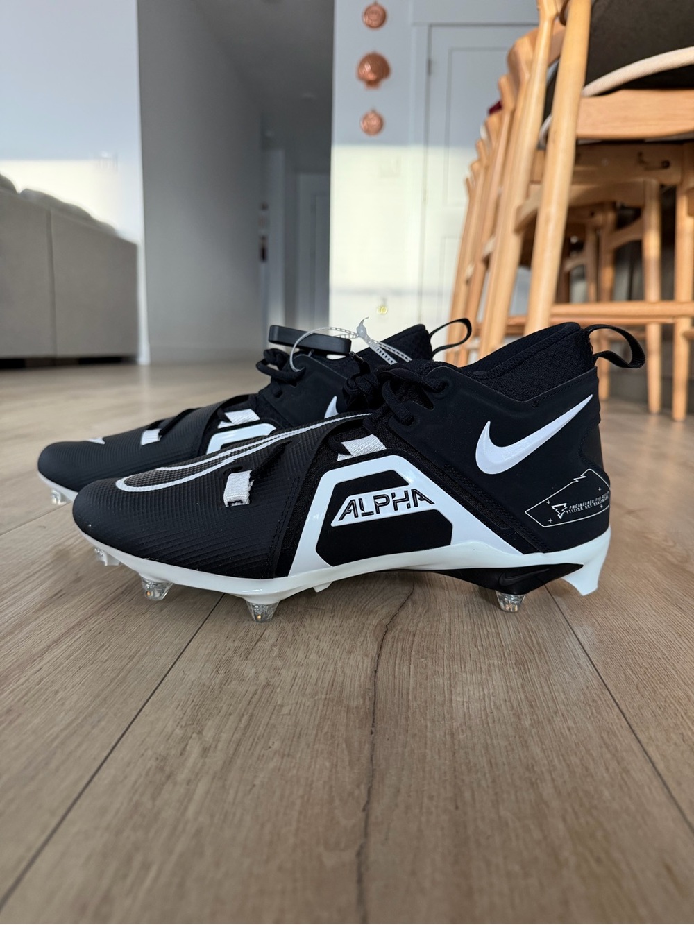 Nike Alpha Menace Pro 3 Mid Football Cleats in the black and white